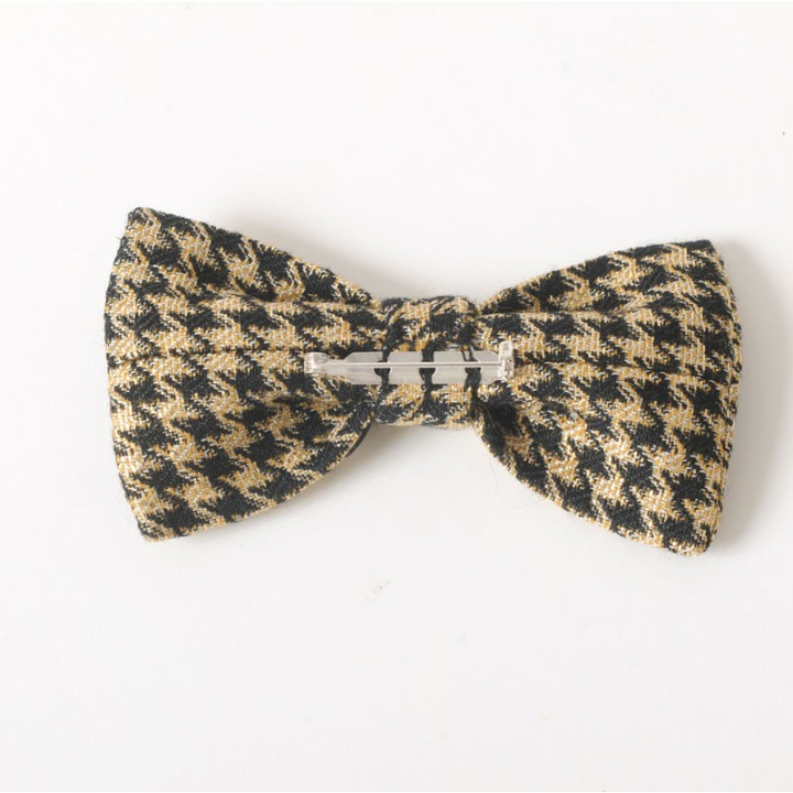 Golden and black fabric bow brooch