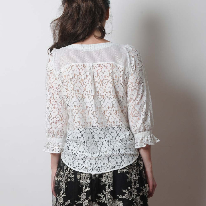 White lace women's shirt with ruffled sleeves