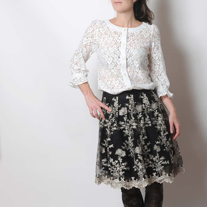 White lace women's shirt with ruffled sleeves
