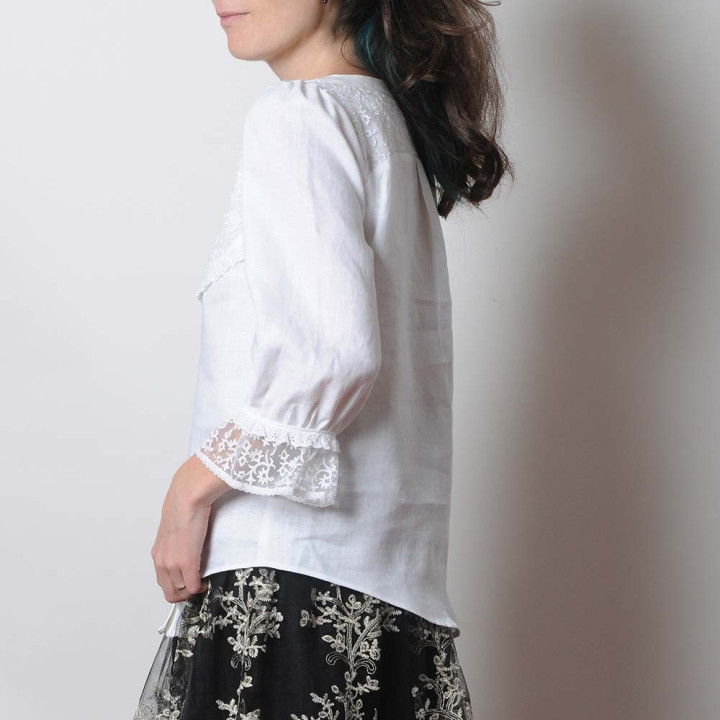White linen and raised lace women's shirt with ruffled sleeves