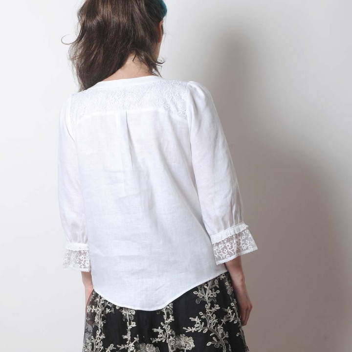 White linen and raised lace women's shirt with ruffled sleeves