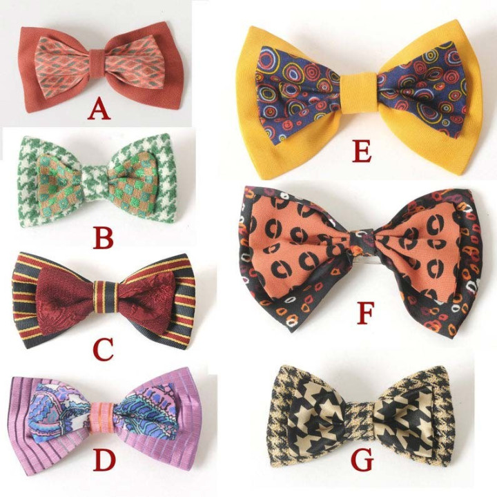 Golden and black fabric bow brooch