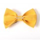 Golden and black fabric bow brooch