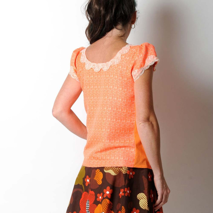 Short sleeved neon orange top, beige lace collar