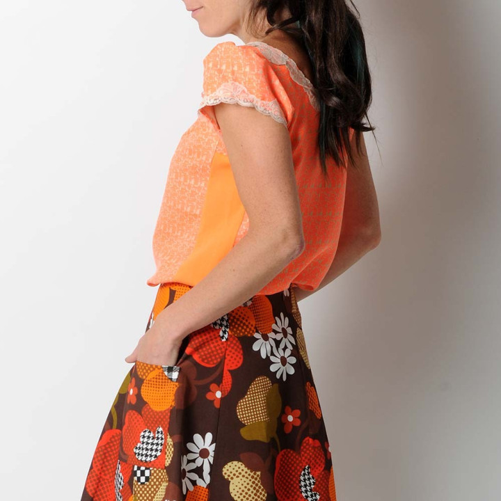 Short sleeved neon orange top, beige lace collar