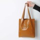 Dark orange leather shopping tote bag, with two pockets