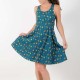 Colorful cotton jersey dress with bird print, crossed straps and flared cut