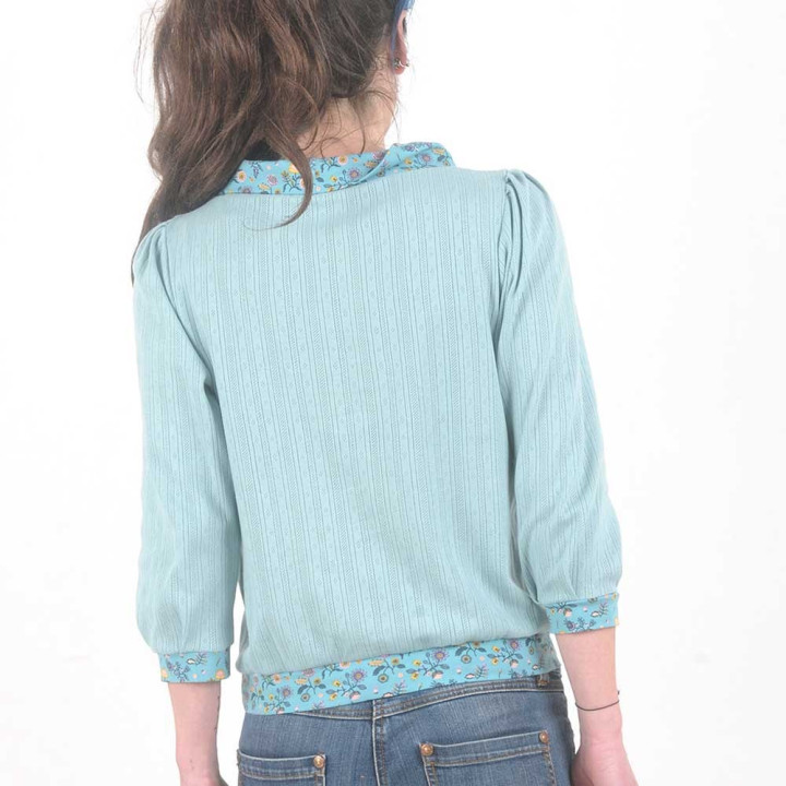 Soft pale blue cotton jersey blouse with floral details