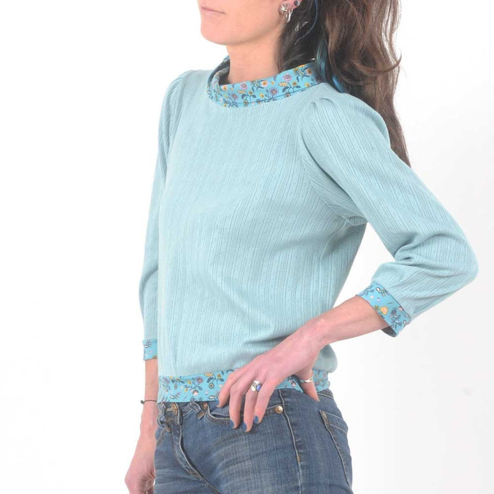 Soft pale blue cotton jersey blouse with floral details