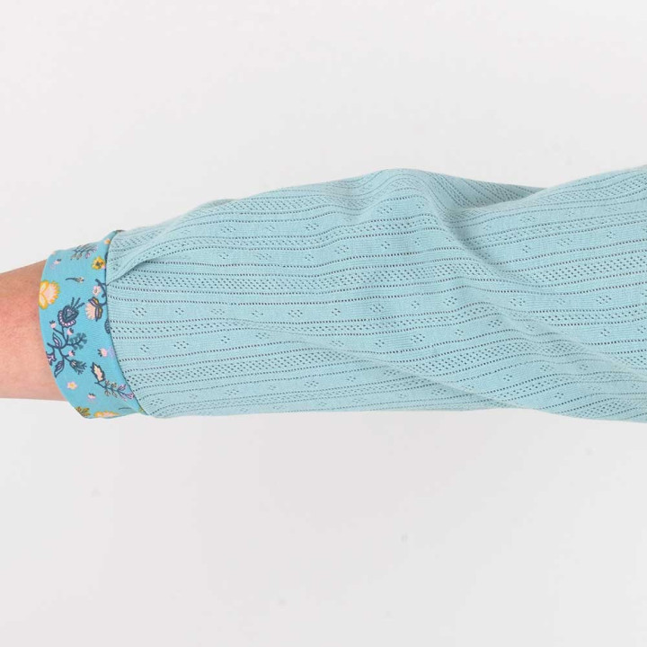 Soft pale blue cotton jersey blouse with floral details