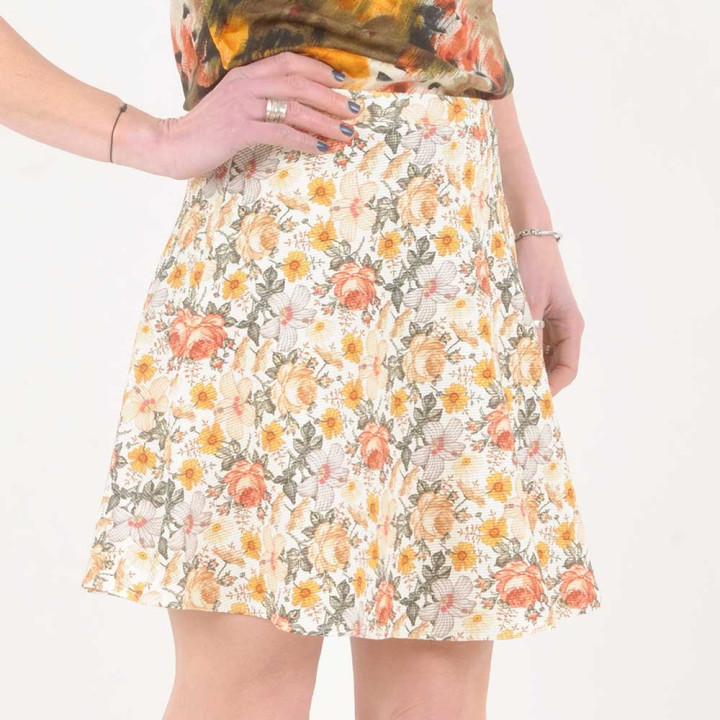 Short beige and orange floral jersey skirt