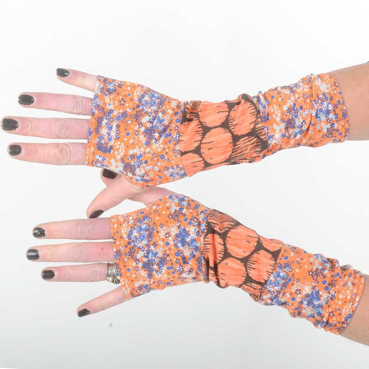 Colorful armwarmers in a patchwork of orange printed jersey