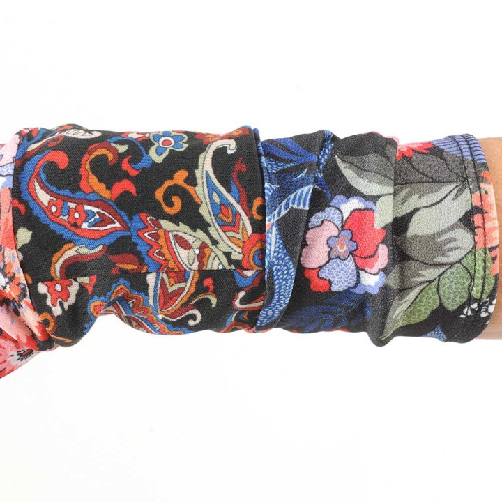 Long floral armwarmers in a patchwork of black and colorful jersey