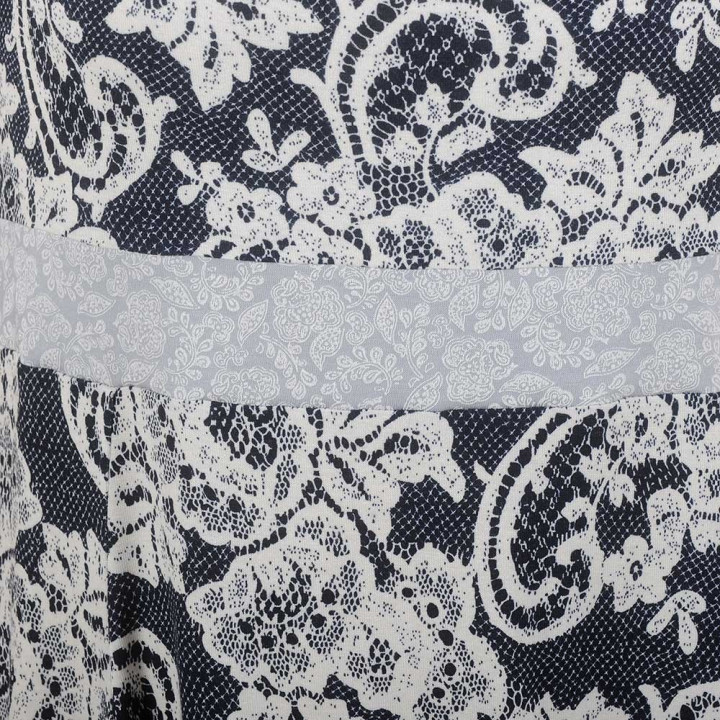 Blue and white sleeveless dress with lace print