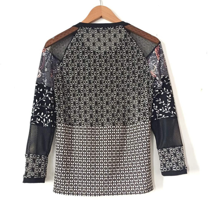 Original black and white women’s top with lace, mesh and printed jersey sleeves.