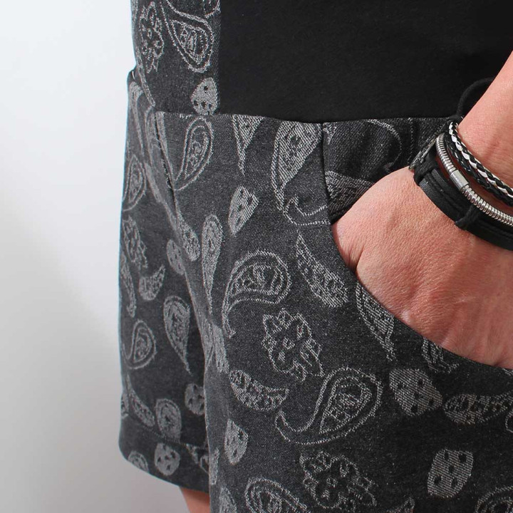 Detail of dark grey womens shorts with stretchy black waistband, handmade by French clothing designer