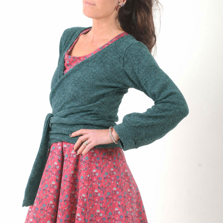Designer dark green knit wrap cardigan with a crossover neckline and balloon sleeves