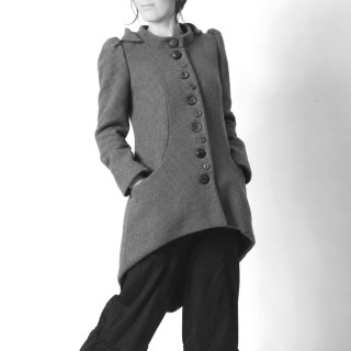 Structured asymmetrical women’s coat with large round hood